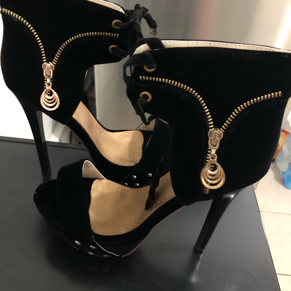Black open toe suede platform heels.